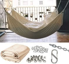 there is a hammock hanging in the air with chains and hooks attached to it