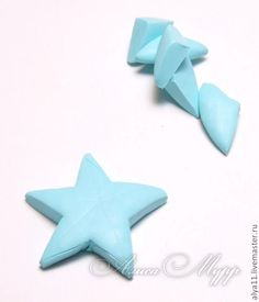 two small blue stars on a white surface