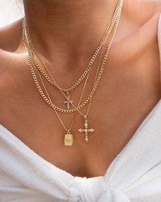 Dainty zirconia cross pendant in a figaro gold filled chain. Dimensions Pendant is 27 mm Chain is 20'' Materials Pendant is 18k gold filled over brass and cubic zirconia and chain is 18k gold filled. *Hypoallergenic *Nickel free Notes ~ Soft jewelry pouch included. ~ Limit contact with water for longer durability and prevent tarnishing ~ Avoid contact with household chemicals like perfume, sprays, lotions, sunscreen and hair products. ~ Store your jewelry separately from other jewelry when not i Necklace Combos, Maria Necklace, Necklace Stacking, Soft Jewelry, Starburst Pendant, Dainty Cross Necklace, Jewelry Aesthetic, Chunky Chain Necklaces, Necklace Layering