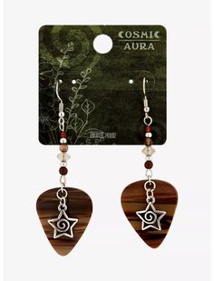 a pair of wooden guitar pick earrings with dangling beads and an evil eye on it