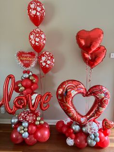 valentine's day decorations and balloons in the shape of hearts