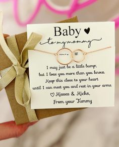 a hand holding a card that says baby, i may just be a little bunny