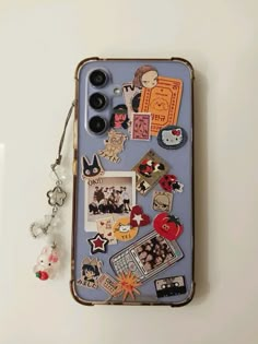 a cell phone case with many different things on the back and inside, including buttons