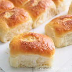 several pieces of bread sitting on top of a white paper towel next to each other