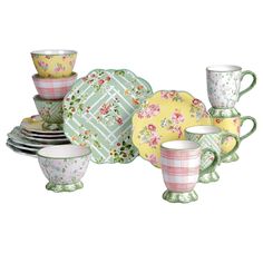 an assortment of dishes and cups with floral designs on them, all in pastel colors