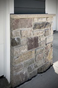 the corner of a building made out of stone