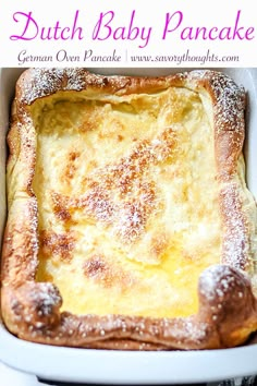 a close up of a casserole in a pan with powdered sugar on top