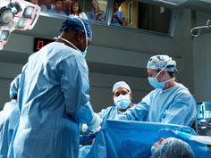 medical personnel performing surgery in an operating room