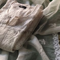 Nibs Tog Roohani Ivory Chikankari Kuta with Dupatta Set Pure Mulmul Chanderi (Semi Stitched), Indian Ethnic Party Wear Chikankari Suit Dyeble Shop More Chikankari outfits by Nibs Tog on our Shop : https://www.etsy.com/in-en/shop/NibsTog PLEASE NOTE: Since its hand embroidery, every design has single piece only, therefore, you may get a different design motif Suit. This also ensures the uniqueness of the outfit you will receive. Please connect us to check the designs available. Package Includes: Kurta+Dupatta Features: Fabric: The Ivory Chikankari Suit is made of Pure mulmul Chanderi Cotton fabric. Super soft & versatile. Style: The Chikankari Suit is made in Slight A Line pattern. The Suit is Semi Stitched and has Chikankari hand embroidery, embellished with mukaish. Colour: The Chikankari White Mulmul Churidar For Festivals, Elegant White Mulmul Anarkali Set, Elegant White Cotton Churidar, Festive White Mulmul Churidar, White Mulmul Salwar Kameez For Festivals, Elegant White Cotton Anarkali Set, White Mulmul Anarkali Set For Festivals, Traditional White Mulmul Churidar, Bollywood Style White Mulmul Salwar Kameez