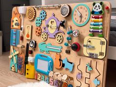 a child's wooden peg board with lots of magnets on it