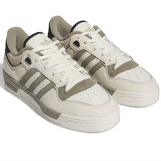 With Roots In The 1980s Basketball Archives, Adidas Rivalry Shoes Now Have Influence Far Beyond The Hardwood. Adopted By Skaters, Punks And Artists Alike, They Represent A Certain Nostalgia That Also Rocks Attitude. Made With A Leather And Nubuck Upper, This Release Has A Low-Profile And Muted Colors For A Premium Look. The Rubber Outsole Provides Traction And Stability. Lace Closure Leather Upper Textile Lining Rubber Cupsole Adidas Shoes Mens Sneakers, Adidas Ultra Boost Men, 1980s Basketball, Grey Adidas Shoes, Taekwondo Shoes, Customize Shoes, Adidas Rivalry Low, Purple Trainers, Adidas Rivalry