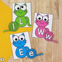 three pictures of cats with the letters e and w in them on a wooden surface