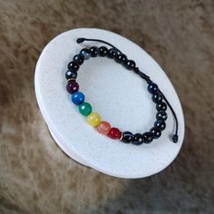 LGBTQ Rainbow Gemstone Bracelet - Discreet Pride Bracelet, Adjustable Cord Jewelry, Handmade Gift for Women's & Men's LGBTQ Rainbow Bracelet, a stunning Pride Gemstone Bracelet featuring the iconic Gay Flag colors. This Adjustable String Bracelet, handmade with care, makes for a perfect Pride Month Gift or a thoughtful Christmas Gift for Her and Him. Details: - Minimalist, elegant, and casual design. - Crafted with 6mm rainbow color agate and black agate stones, hematite beads. - Adjustable fit Adjustable Multicolor Pearl Bracelet With Gemstone Beads, Adjustable Gemstone Bead Bracelets, Adjustable Pearl Bracelet With Natural Stones, Adjustable Pearl Bracelet With Round Natural Stones, Adjustable Pearl Bracelet With Natural Round Beads, Adjustable 8mm Beads Bracelet, Adjustable Rainbow Bracelets With 8mm Beads, Adjustable Crystal Bangle Bracelet With 8mm Beads, Adjustable Rainbow Jewelry With 8mm Beads