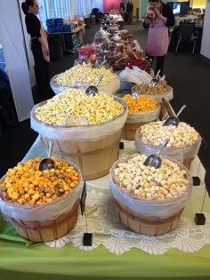 several baskets filled with popcorn on top of a table