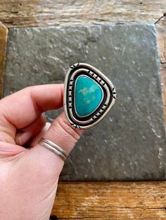 Handmade Tyrone Turquoise and sterling silver statement ring.  -Ring will fit US size 9 Vintage American Southwest style design. Beautiful teal green- blue coloartion . Hand stamped double shadowbox design.  Hand polished, rustic looking patina and high polish finish.  Hand stamped Indian style Arrow and Rising Sun hallmark on backside. Chunky, double split style ring shank/band.   Turquoise stone is sourced from the Tyrone turquoise mine in New Mexico.   100% Sterling silver. ------------------ Big Turquoise Ring, Vintage Turquoise Ring, Ring Shank, Ladies Ring, American Southwest, Ring Ideas, Statement Ring Silver, Paper Jewelry, Southwest Style