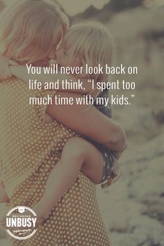 two children hugging each other with the quote you will never look back on life and think, i spent too much time with my kids