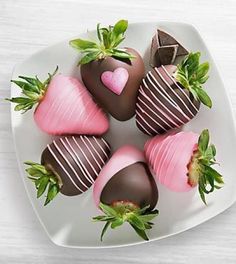 chocolate covered strawberries arranged on a white plate