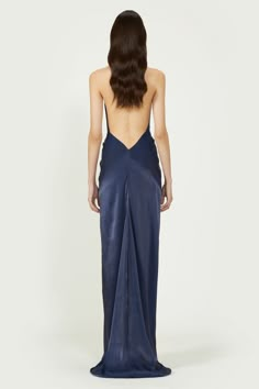 The figure-skimming Colette lurex georgette halterneck gown will ensure all eyes are on you at your next event. Cut from silky lurex georgette, this sexy silhouette falls like liquid to a long floor-pooling hemline for a dramatic impact. The deep open-back is mirrored on the front with a plunging neckline that’s accentuated with a knotted waistline. This draped gown is spliced to the thigh – perfect for showing-off towering sandals. Available in cobalt blue and coral. COSTARELLOS SIZE CHART32 FR Sum Dresses, Award Show Dresses, Formal Chic, Draped Gown, Prom Dress Inspo, Drape Gowns, Dark Blue Dress, Prom Long, Prom Dress Inspiration