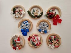 twelve christmas ornaments are arranged in circles on a table