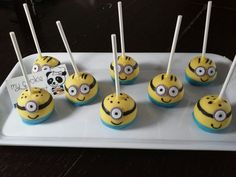 minion cupcakes are arranged on a tray with toothpicks in the shape of eyes