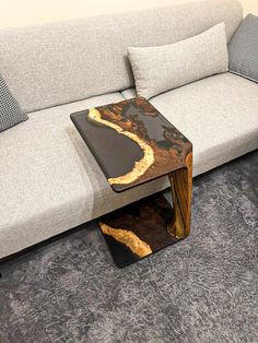 a couch with a table on top of it