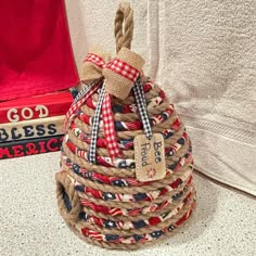 a small basket made out of rope and burlocks