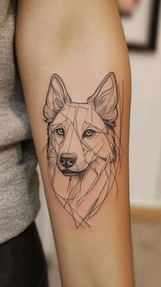 a woman's arm with a tattoo of a wolf