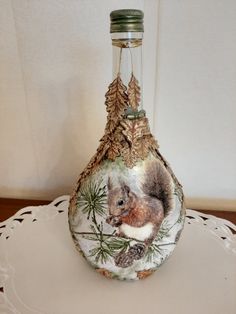 a glass bottle with a squirrel on it