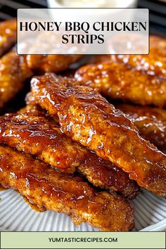 honey bbq chicken strips on a plate with dipping sauce