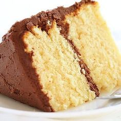 a piece of cake on a plate with a fork next to it and one slice missing