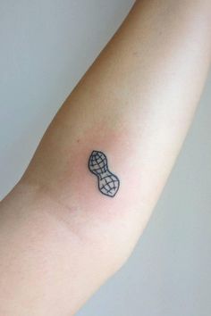 a small tattoo on the arm of a person's left arm, with an image of a shoe