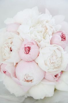 a bouquet of white and pink flowers