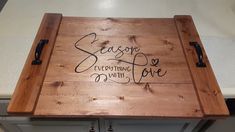 a wooden cutting board that has writing on it with the words season's eve