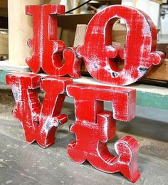 the letters are painted red to spell out love