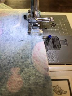 the sewing machine is working on the fabric