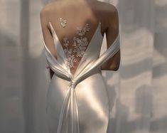 the back of a woman's wedding dress