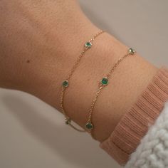 Our new 14k Emerald Yard Bracelet creates a simple yet vibrant pop to your bracelet stack. This bracelet features 5 stunning genuine emeralds and a dainty, yet sturdy chain. 14k Solid Gold and Genuine Emeralds .33 CTW 2.5mm Emerald Dimensions Available in lengths 6.5" and 7" In the wrist photo, this version is the smaller of the two. Due to the handmade nature of this bracelet, please allow 1 - 2 weeks for processing. Timeless Green Bracelet As Gift, Elegant Gemstone Bracelet, Green Emerald Bracelet, Emerald Bracelet, Emerald Necklace, Dainty Bracelets, Bracelet Stack, Gemstone Bracelet, Delicate Bracelet