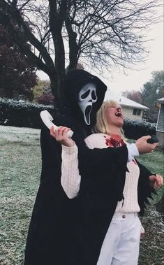 two people dressed up as ghost and dracula