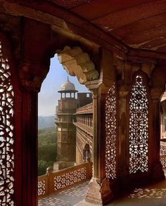 an intricately carved wooden structure overlooks the valley