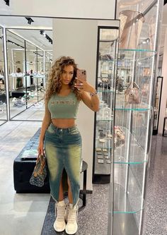 a woman standing in front of a display case