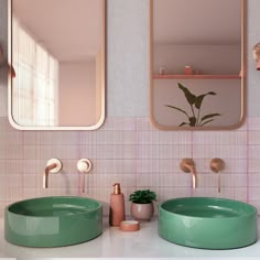 there are two sinks in the bathroom with mirrors on the wall above them and one is green