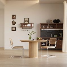 an empty room with a table, chairs and shelves on the wall next to it