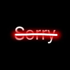 the word sorry is lit up in red and white