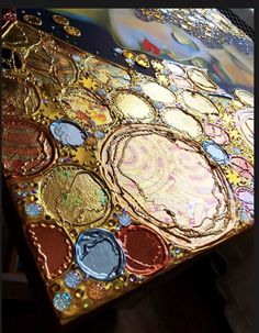 a close up of a table with many different colors and designs on it, including circles