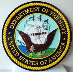 the department of the navy seal is on display in front of a white wall and blue background