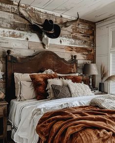 a bed with a wooden headboard and pillows on top of it in a bedroom