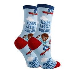 You'll be living out Happy Little Dreams with these fuzzy Bob Ross socks! Brand new for 2022 - grab a pair of these cute, blue Bob Ross socks as he skates and paints with his fro and beard made from extra fuzzy yarn. The perfect gift for anyone who loves to dream or paint with Bob. This pair of mid-calf crew length novelty socks come in one size that fits most women's feet. Made of 65% Combed Cotton, 32% Nylon, 3% Spandex. We have the same design also available in a larger men's size which you c Funny Blue Socks For Gift, Playful Super Soft Socks For Gifts, Super Soft Playful Socks For Gift, Sock Store, Blue Bob, Bob Ross, Novelty Socks, Sock Shoes, Crew Socks