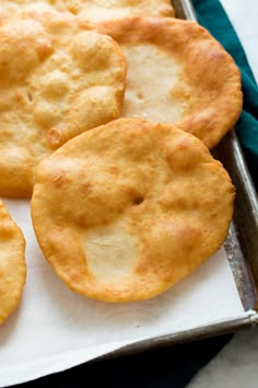 some biscuits are sitting on a baking sheet