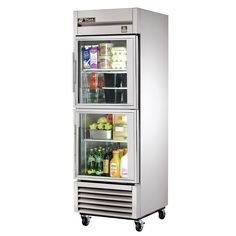 a stainless steel refrigerator with two doors and shelves filled with drinks, juices and condiments