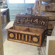 a wooden crate with the word ethan carved into it